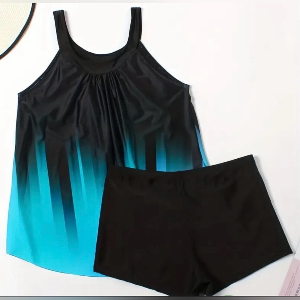 NWOT.Two-piece tankini swimsuit.Black/blue stripe printed top,boy shorts.Sz XL